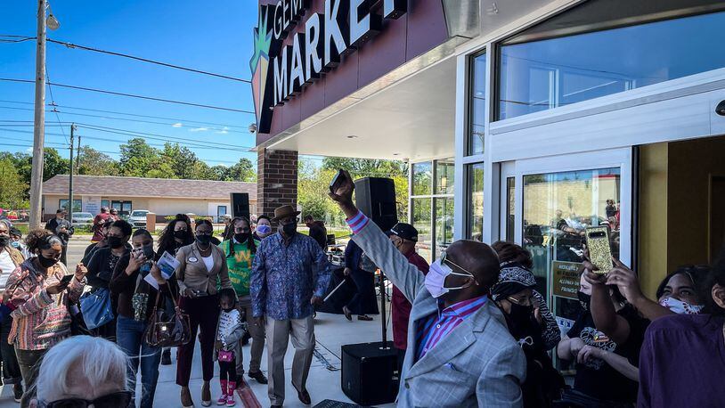 More than 175 people applauded when the Gem City Market opened for business on Wednesday, a sign that it’s more than just a grocery store ― it’s a community-led movement, an oasis in the middle of a major food desert and a major investment in an area that has been underserved. JIM NOELKER/STAFF