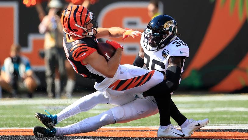CINCINNATI, OHIO - OCTOBER 20: Alex Erickson #12 of the Cincinnati Bengals is tackled by Ronnie Harrison #36 of the Jacksonville Jaguars at Paul Brown Stadium on October 20, 2019 in Cincinnati, Ohio. (Photo by Andy Lyons/Getty Images)