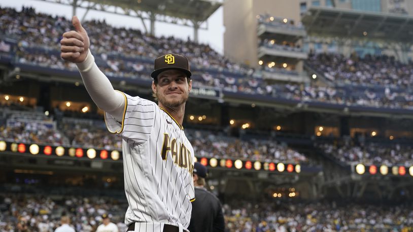 San Diego Padres first baseman Wil Myers reacts to fans before Game 3 of a baseball NL Division Series against the Los Angeles Dodgers, Friday, Oct. 14, 2022, in San Diego. (AP Photo/Ashley Landis)