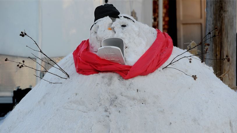 This giant snowman looks hungry for the mail along Dayton-Springfield Road in Enon, Feb. 17, 2021. MARSHALL GORBY\STAFF