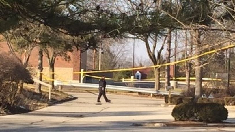 Englewood police investigate the officer-involved shooting that happened Feb. 5, 2017, on the property of the former Englewood Inn on South Main Street. DeANGELO BYRD/STAFF
