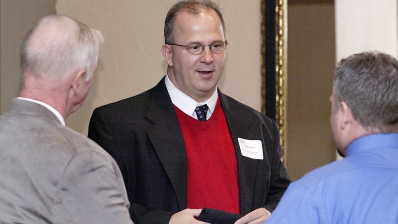 Vern Oakley of Miller-Valentine Group and Miamisburg City Manager Keith Johnson, center, during the Dayton Area Chamber of Commerce Breakfast Briefing in 2012.