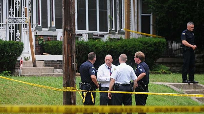 Dayton police investigate an unofficial total of 42 homicides in 2016, which matches a 16-year high. Here, officers were called to a triple homicide at 35 Oxford Ave. on Wednesday Aug. 10, 2016. Muhammad Shabazz Ali, 61, is accused of shooting to death Tammy Cox, 53, Michael D. Cox, 25, and Jasper Taylor, 74. MARSHALL GORBY / STAFF