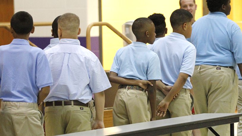 Dayton Boys Prep Academy students wait in line for a trip to the cafeteria on the first day of the 2018-2019 school year. TY GREENLEES / STAFF