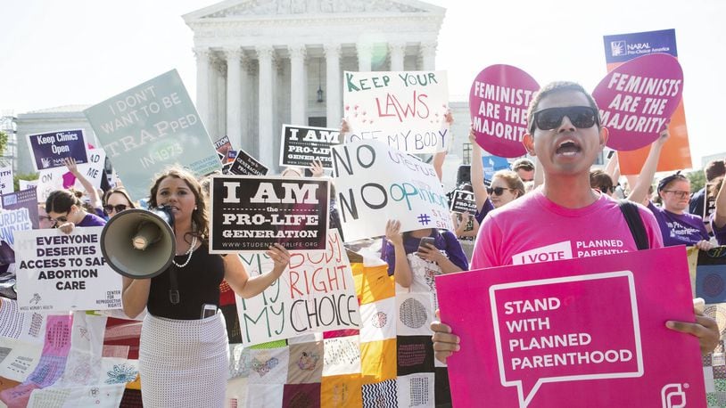 Pro-abortion rights and anti-abortion protesters rally in front of the U.S. Supreme Court in Washington, June 27, 2016. The court is expected to finish its term today with a decision on abortion - a case deciding the constitutionality of two provisions of a Texas law regulating abortion could affect access to abortions for millions of women in several states. (Zach Gibson/The New York Times)