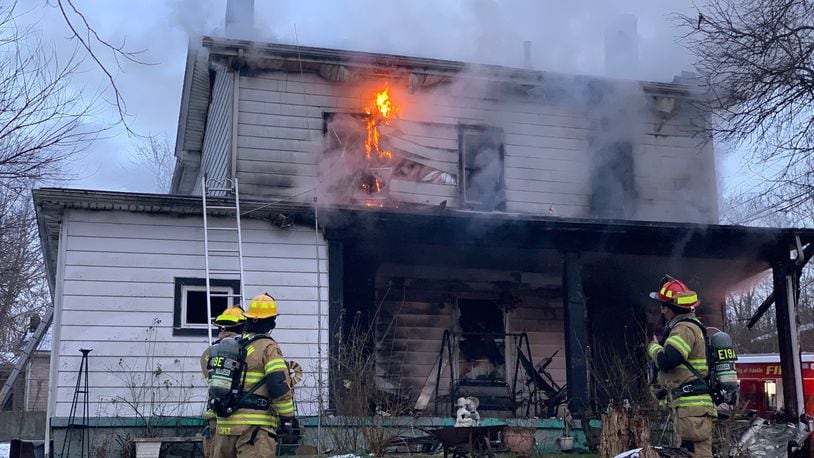 Franklin firefighters battle a blaze at a two-story home on Wilson Avenue Tuesday afternoon. An elderly resident was removed from the house and a firefighter was injured. CONTRIBUTED/FRANKLIN DIVISION OF FIRE