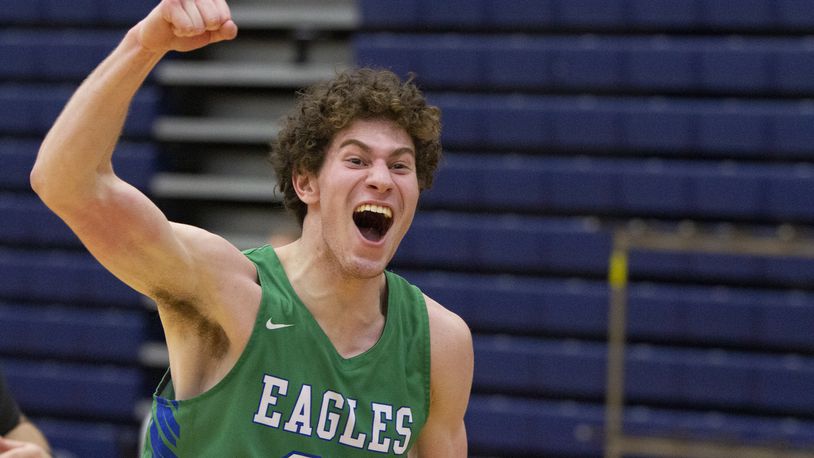 Chaminade Julienne senior Daniel Nauseef celebrates toward the student section as he leaves the floor after the Eagles defeated Alter 69-60 in the Division II district semifinals Friday at Fairmont High School's Trent Arena. Jeff Gilbert/CONTRIBUTED