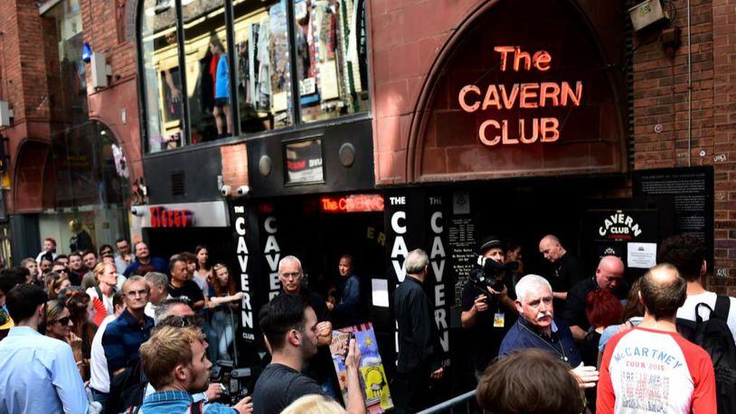 Fans of Paul McCartney make their way inside The Cavern Club in Liverpool on Thursday afternoon.