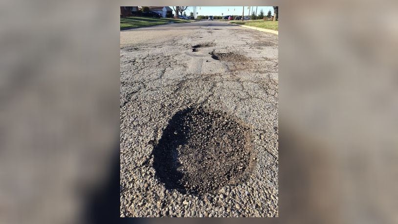 Colorado Drive is among Xenia’s streets in dire need of new pavement. RICHARD WILSON/STAFF