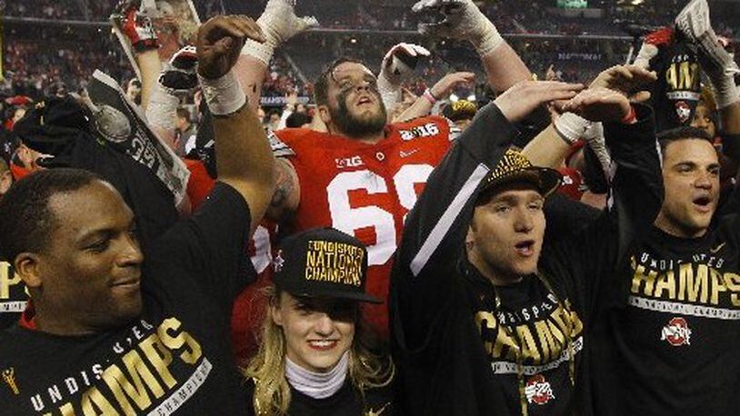 Ohio State’s Taylor Decker sings “Carmen Ohio” after a victory against Oregon in the national championship game on Monday, Jan. 12, 2015, at AT&T Stadium in Arlington, Texas. David Jablonski/Staff
