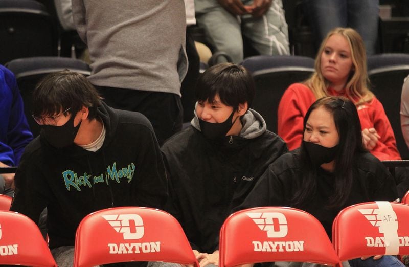 Enkhiin-Od Michael Sharavjamts, a recruit in the 2022 class, watches a game between Dayton and Cedarville in an exhibition game on Monday, Nov. 1, 2021, at UD Arena. David Jablonski/Staff