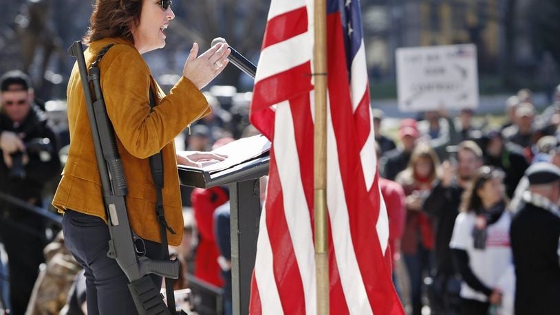 Lt. Gov. Mary Taylor carried a shotgun at a rally of gun groups such as Ohio Carry Saturday, March 10 at the Statehouse. Photo by Eric Albrecht/Columbus Dispatch