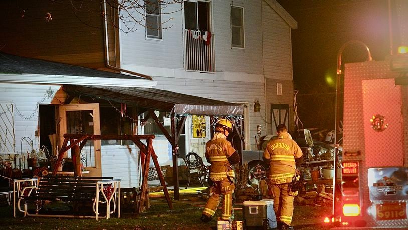 A Fairborn firefighter was injured and a family dog killed in a house fire Monday night, Nov. 21, 2022, on Cleary Drive. MARSHALL GORBY/STAFF