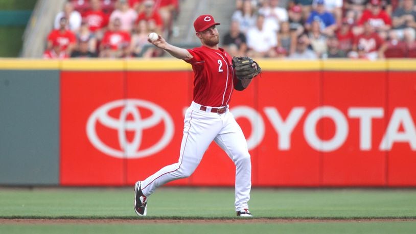 Reds shortstop Zack Cozart throws to first for an out against the Dodgers on Friday, June 16, 2017, at Great American Ball Park in Cincinnati.