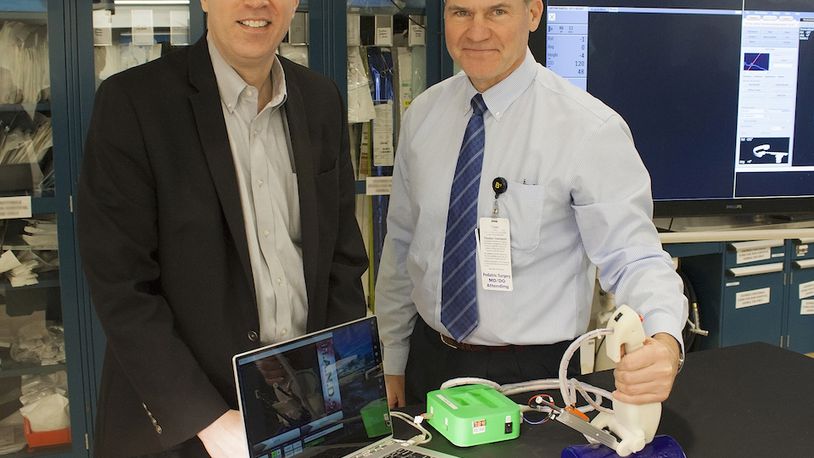 Andrew Cothrel, left, and Dr. Daniel von Allmen, devised a new needle-guilding system that recently won a CincyTech investment. CONTRIBUTED.