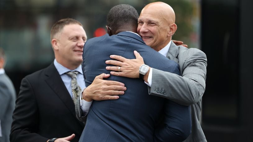 Dayton's Anthony Grant gets a hug from Massachusetts coach Frank Martin at Atlantic 10 Conference Media Day on Thursday, Oct. 13, 2022, at the Barclays Center in Brooklyn, N.Y. David Jablonski/Staff