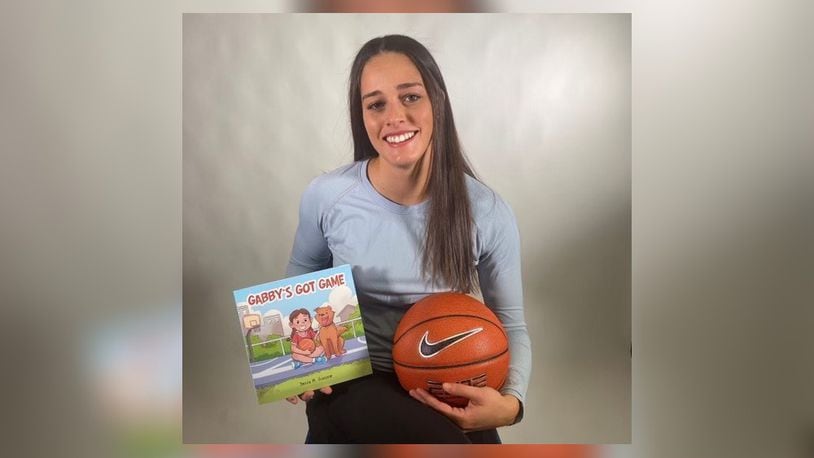 University of Dayton women's basketball player Jenna Giacone and the children's book she wrote, "Gabby's Got Game." CONTRIBUTED