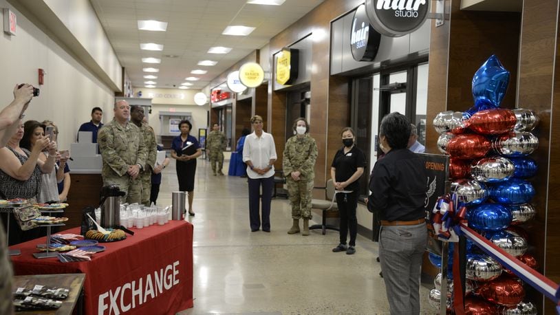Installation leaders join Army & Air Force Exchange Service managers during the opening of Bunker 27 at Wright-Patterson Air Force Base on July 15. A ribbon-cutting ceremony marked the new store’s debut at the Base Exchange. U.S. Air Force photo by Airman 1st Class Jack Gardner
