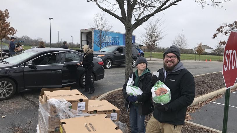 Volunteers pick up turkeys from Bogg Ministries at SouthBrook Christian Church in Miamisburg. Volunteers delivered around 1,000 turkeys to families in need last weekend so that they can have a meal on Thanksgiving.