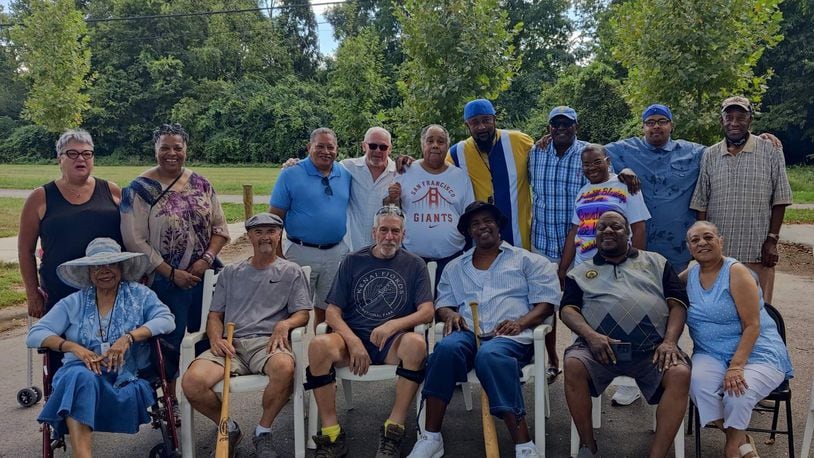 Nearly 50 years after they were pals growing up in their close-knit Lower Dayton View neighborhood, several of the old friends came from various parts of the country and gathered again on a recent Saturday at the old field – “Our Field of Dreams” Cliff Pierce called it – and shared memories, laughter and a few tears.
Front row, from left: Terri Ogletree, Kevin Daniel, Mark Dempsey, Alfred Pierce, Tony McCain, and Vicki McCain Moore.
Back row, from left: Martha Hardcastle, Carol Ogletree, Howard Jordan, David Chadwell, Ondray Coble, Cliff Piece. Andy Davenport, Denise Jones, David Davenport and Royal Starks .
 Jeanne Frazer-Coble/CONTRIBUTED.