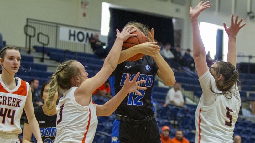 Beavercreek's Charlotte Pauling (5) and Mia Patterson stop Springboro's Bryn Martin during Saturday's game at Flyin' To The Hoop at Trent Arena. CONTRIBUTED/Jeff Gilbert