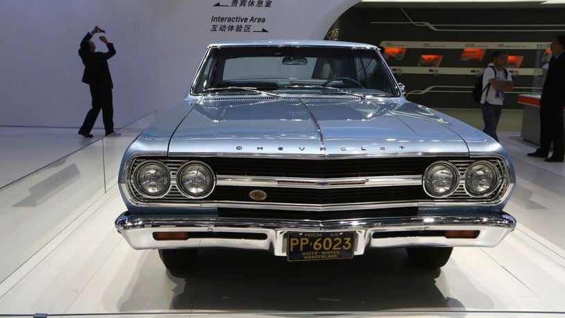 FILE - A 1965 Chevrolet Malibu is displayed at the company's booth during Guangzhou 2013 Auto Show in China's southern city of Guangzhou, Nov. 21, 2013. The Malibu, the last midsize car made by a Detroit automaker, is heading for the junkyard. General Motors confirmed Thursday, May 9, 2024, that it will stop making the car introduced in 1964 as the company focuses more on electric vehicles. (AP Photo/Kin Cheung, File)