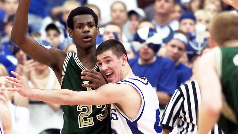 First-year Lebanon boys coach Nathan Chivington (right) gets defensive with a famous Akron St. Vincent-St. Marys alum during the D-III state championship in 2001 at Columbus. Chivington played at Miami East. FILE