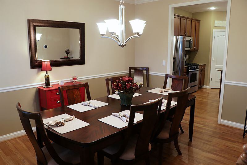 The formal dining room has a tray ceiling and is accessible from the 2-story foyer and the kitchen. CONTRIBUTED PHOTO BY KATHY TYLER
