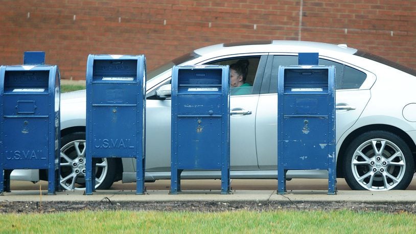 The Beavercreek Police Department is warning residents against using blue mailboxes when mailing items such as cash or checks after receiving reports of thefts from the collections boxes outside U.S. Post Offices. MARSHALL GORBY\STAFF