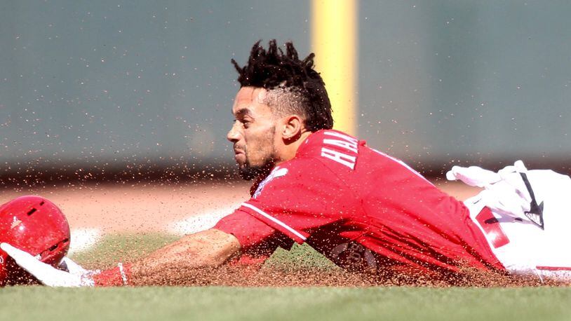 The Reds' Billy Hamilton steals third base against the Giants on Sunday, May 7, 2017, at Great American Ball Park in Cincinnati. David Jablonski/Staff