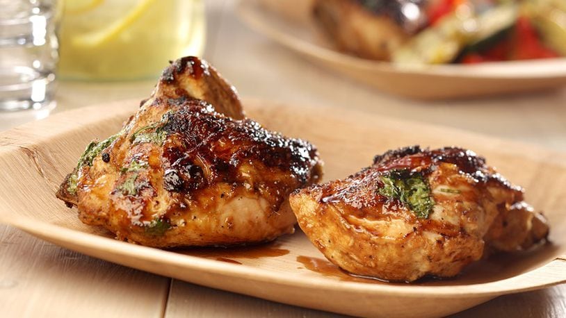 Give chicken a long bath in a coconut, lime, jalapeno and ginger marinade before grilling. (Michael Tercha/Chicago Tribune/TNS)