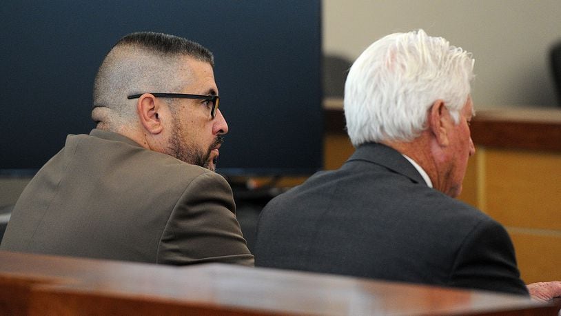 Former Butler Twp. Police sergeant, Todd Stanley, left, sits with his attorney at his sentencing hearing in Vandaila Municipal Court, Friday, Sept. 29, 2023.  MARSHALL GORBY\STAFF