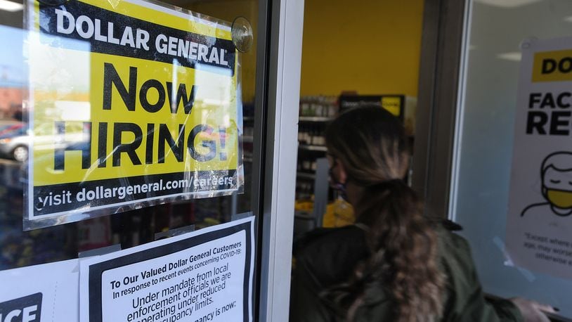 Dollar General is hiring at the Woodlane Plaza in Dayton. MARSHALL GORBY\STAFF