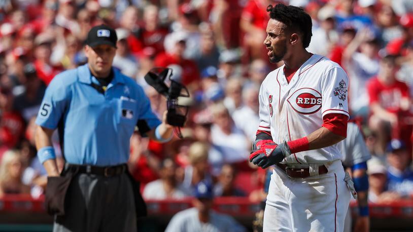 Cincinnati Reds’ Billy Hamilton, right, reacts after arguing balls and strikes with umpire Stu Scheurwater, left, in the second inning of a baseball game, Saturday, June 17, 2017, in Cincinnati. (AP Photo/John Minchillo)
