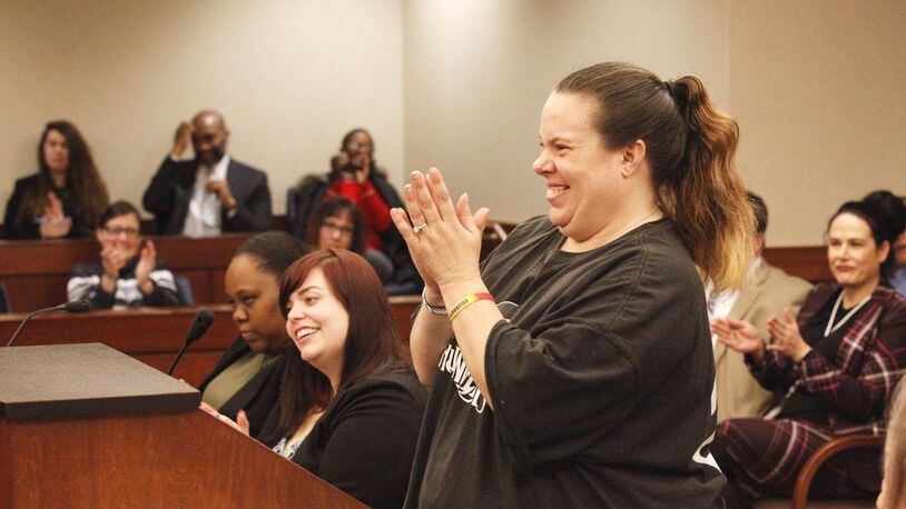 Through their efforts and help during a specialty court, Dayton couple Jennifer Buehler, pictured, and Eddie Thomas were returned custody of their 11-year-old son last week. They were both applauded Wednesday in Montgomery County Juvenile Court’s Family Treatment Court, a program aimed to help keep families intact following parental drug use. CHRIS STEWART / STAFF