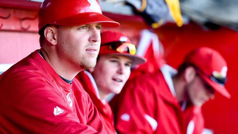 Sinclair baseball coach Steve Dintaman watches his team from the dugout during their game against Miami Hamilton Thursday, April 23, 2015, at Foundation Field in Hamilton. NICK GRAHAM/STAFF