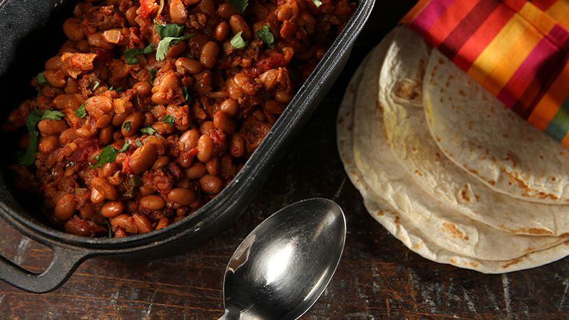Charro beans get their flavor from bacon, Mexican chorizo and jalapeno. (Abel Uribe/Chicago Tribune/TNS)