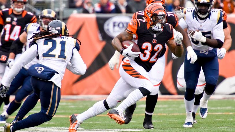 Cincinnati Bengals running back Jeremy Hill carries the ball during their 31-7 win over the St. Louis Rams Sunday, Nov. 29 at Paul Brown Stadium in Cincinnati. NICK GRAHAM/STAFF