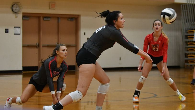 Carly Pfieffer receives the ball as Brennah Hutchinson (left) and Emmie Jackson (right) watch. GREG BILLING / CONTRIBUTED
