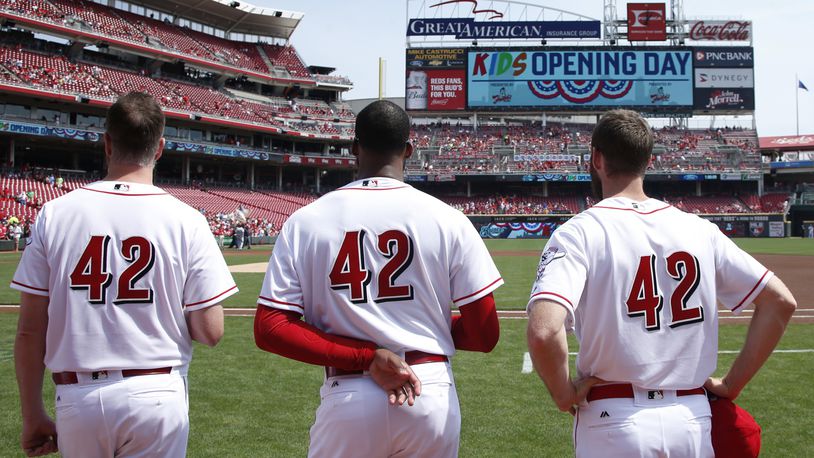 CINCINNATI, OH - APRIL 15: Cincinnati Reds players wear No. 42 in honor of Jackie Robinson Day as they stand for the national anthem prior to a game against the Milwaukee Brewers at Great American Ball Park on April 15, 2017 in Cincinnati, Ohio. (Photo by Joe Robbins/Getty Images) *** BESTPIX ***