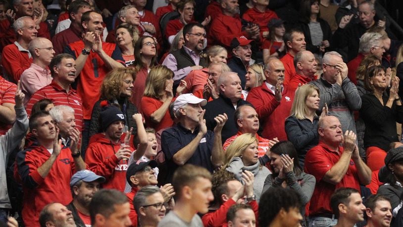 Dayton fans cheer during a game against George Mason on Wednesday, Jan. 23, 2019, at UD Arena. David Jablonski/Staff