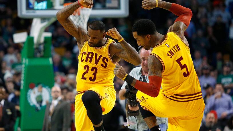 FILE - In this Dec. 15, 2015, file photo, Cleveland Cavaliers’ LeBron James and J.R. Smith (5) dance before an NBA basketball game against the Boston Celtics in Boston. James stepped into free agent J.R. Smith’s contract situation Friday, Sept. 30, 2016, and said the Cavs need to sign the shooting guard. Smith had a major role in the Cavs winning an NBA title last season and James feels he’s earned a new deal. Smith made $5 million last season. (AP Photo/Winslow Townson, File)