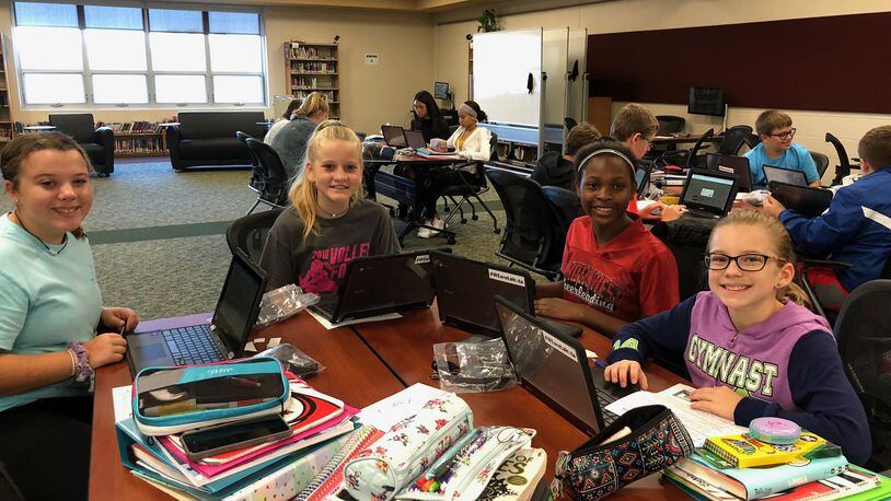 Students at Lakota Plains Junior School in Liberty Township are all smiles after receiving their Chromebooks as part of a historic pilot program to enhance student learning through the digital devices.