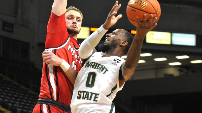 Wright State's Amari Davis, 0, takes a shot against Youngstown State's William Dunn, 11, during the first half of a Horizon Conference game at the Nutter Center on Sunday, Dec. 4. DAVID A. MOODIE/CONTRIBUTING PHOTOGRAPHER