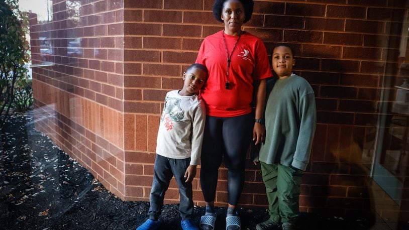 Ashley Brown and her two sons, Dominic, left, and Leonne survived a horrific accident, and with the help of Premier Health and Dayton Children's, the family are back on their feet. JIM NOELKER/STAFF