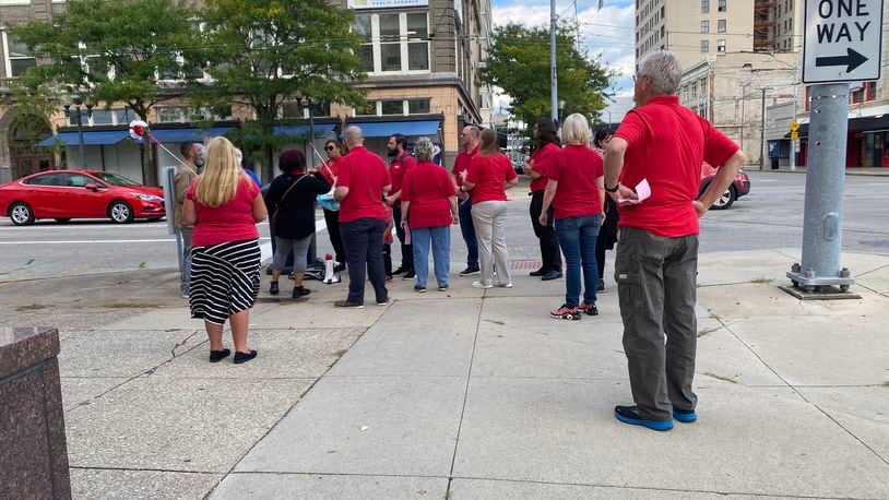 Members of the Dayton Education Association protest on South Ludlow Street near the Dayton Public School's headquarters in September. Eileen McClory / staff
