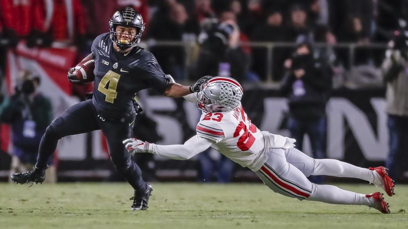 Rondale Moore #4 of the Purdue Boilermakers runs the ball and tries to fight off Jahsen Wint #23 of the Ohio State Buckeyes at Ross-Ade Stadium on October 20, 2018 in West Lafayette, Indiana. (Photo by Michael Hickey/Getty Images)