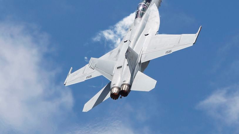 An F/A-18E Super Hornet performs at the Vectren Dayton Air Show in June 2017. GE Aviation operations in Vandalia produce alternative generators for the fighter jet. TY GREENLEES / STAFF