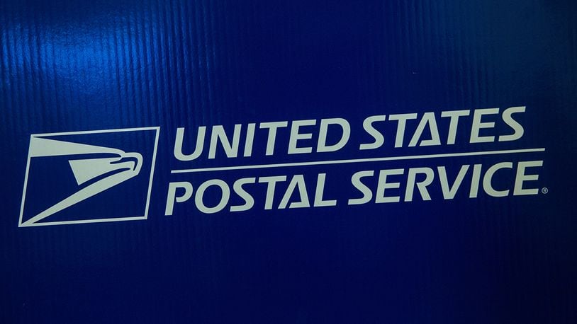 Signage for the United States Post Office (USPS) is seen on September 25, 2013 in New York City.