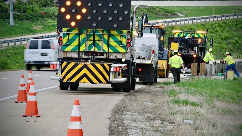 Road crews replace replace guard rails on the I-75 northbound exit ramp to I-70 eastbound on Wednesday, April 17, 2024. MARSHALL GORBY \STAFF